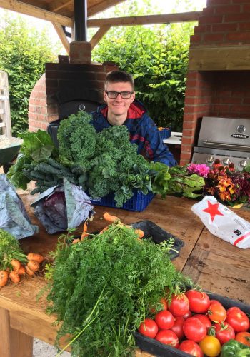 farm helper preparing produce for the veg shed
